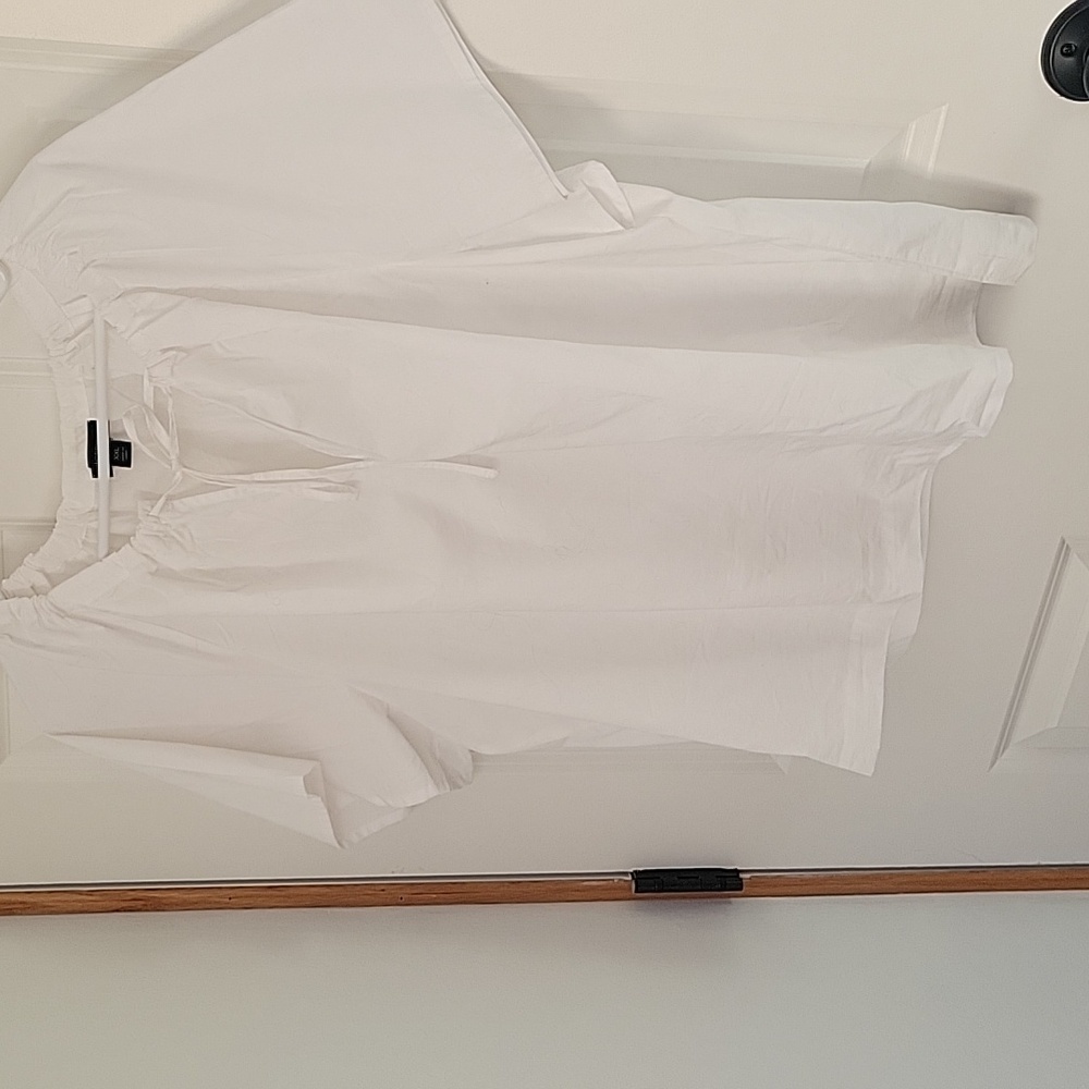 White top. New without tags. Never worn.